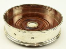 A 20TH CENTURY HALLMARKED SILVER WINE COASTER