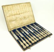 AN EARLY 20TH CENTURY CASED SET OF TWELVE SILVER HANDLED KNIVES AND FORKS