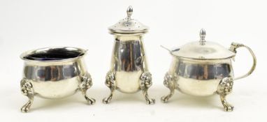 A 20TH CENTURY THREE-PIECE BLUE GLASS LINED HALLMARK SILVER CONDIMENT SET