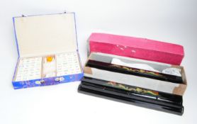 LATE 20TH CENTURY CHINESE MAHJONG SET WITH FOUR BLACK TILE RACKS