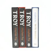 FRY, STEPHEN. THREE SIGNED LIMITED EDITIONS OF TROY & THE FRY CHRONICLES, ALL SIGNED