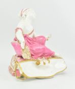 EARLY 20TH CENTURY CONTINENTAL STYLE PORCELAIN CHERUB FIGURINE IN PINK & GOLD