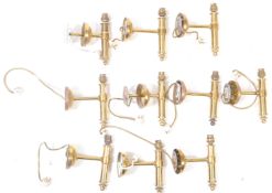 NINE CONTEMPORARY BRASS WALL SCONCES