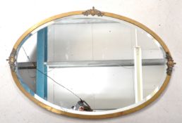 EARLY 20TH CENTURY BRASS FRAMED WALL MIRROR