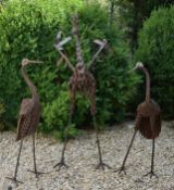 THREE VINTAGE CAST METAL GARDEN HERON / STORK SCULPTURES