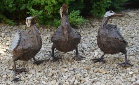 THREE VINTAGE INDUSTRIAL CAST METAL GARDEN DUCK SCULPTURES