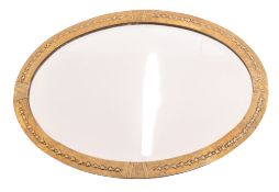 ARTS & CRAFTS EARLY 20TH CENTURY EMBOSSED BRASS OVAL WALL MIRROR
