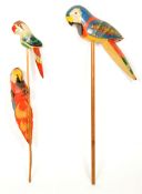 TWO EARLY 20TH CENTURY VINTAGE WOODEN PARROTS MOUNTED ON STICKS