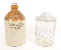 19TH CENTURY MEREDITH & DREW GLASS JAR AND 1927 STONEWARE FLAGON