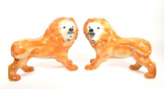 EARLY 20TH CENTURY STAFFORDSHIRE FIRESIDE CERAMIC LION ORNAMENTS