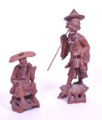 TWO LATE 20TH CENTURY CHINESE HARDWOOD FISHERMAN FIGURES