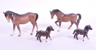BESWICK - FOUR MID CENTURY PORCELAIN BAY HORSES AND FOALS