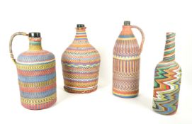 FOUR 20TH CENTURY HUNGARIAN MULTICOLOURED WIREWORK BOTTLES