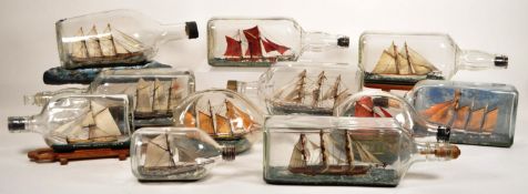 COLLECTION OF ELEVEN 20TH CENTURY SHIPS IN GLASS BOTTLES