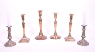COLLECTION OF SIX EARLY 20TH CENTURY BRASS CANDLESTICK HOLDERS
