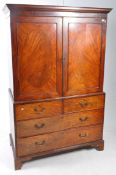 19TH CENTURY GEORGE III FLAME MAHOGANY LINEN PRESS