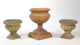 THREE 20TH CENTURY RECONSTITUTED STONE PLANTERS