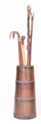 20TH CENTURY COPPERED OAK BARREL STICK STAND COMPLETE WITH WALKING STICKS