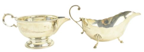 TWO 20TH CENTURY GEORGE V HALLMARKED SILVER GRAVY / SAUCE BOATS