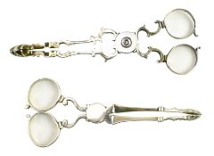 TWO PAIRS OF GEORGE III HALLMARKED SILVER SUGAR NIPS