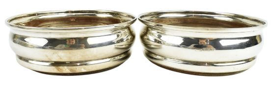 TWO 20TH CENTURY HALLMARKED SILVER WINE COASTERS