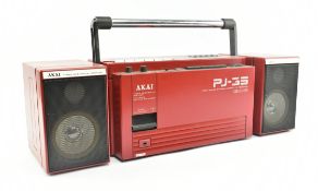 AKAI PJ-33 FOUR BAD STEREO CASSETTE RECEIVER DOLBY SYSTEM & THREE D SPEAKER IN RED COLOURWAY