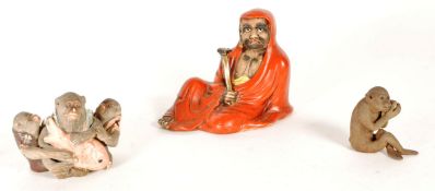 THREE 19TH CENTURY JAPANESE POTTERY FIGURES