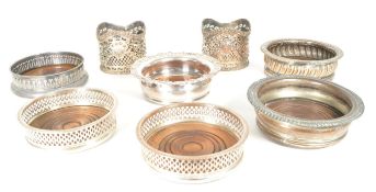 COLLECTION OF VICTORIAN SILVER PLATE BOTTLE COASTERS