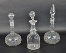 THREE 20TH CENTURY CRYSTAL CUT GLASS DECANTERS WITH STOPPERS