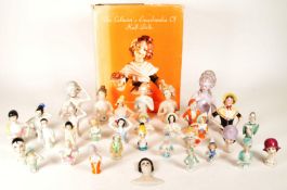 COLLECTION OF 20TH CENTURY PORCELAIN PIN CUSHION HALF DOLLS AND BOOK