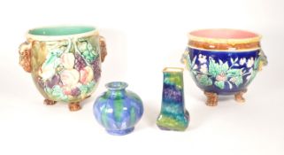 TW0 LATE 19TH CENTURY MAJOLICA PLANTERS WITH 20TH CENTURY VASES