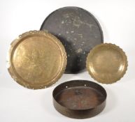 TWO 20TH CENTURY BRASS GONGS AND TWO BRASS CHARGERS / PLATES