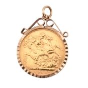 EDWARD VII GOLD FULL SOVEREIGN IN A 9CT GOLD MOUNT