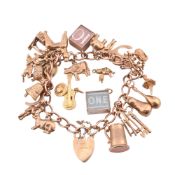 HALLMARKED 9CT GOLD CHARM BRACELET & FOUR LOOSE CHARMS