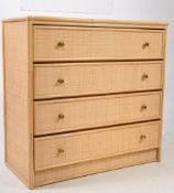 A MID CENTURY RATTAN BAMBOO CHEST OF DRAWERS WITH GLASS TOP
