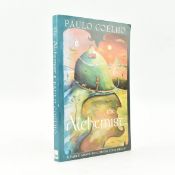 COELHO, PAULO. 1995 THE ALCHEMIST SIGNED AND DOODLED FIRST EDITION THUS