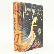HEMINGWAY, ERNEST. TWO FIRST UK EDITIONS IN DUST WRAPPERS