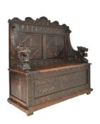 19TH CENTURY VICTORIAN CARVED OAK HALL SETTLE IN THE JACOBEAN STYLE