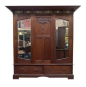 MANNER OF SHAPLAND & PETTER - ARTS & CRAFTS CIRCA 1920S OAK TRIPLE WARDROBE
