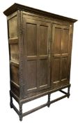 18TH CENTURY CARVED OAK VESTRY CUPBOARD ON STAND