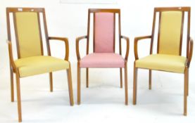 THREE LATE 20TH CENTURY TEAK CARVER DINING CHAIRS / ARMCHAIRS