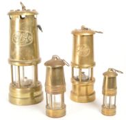 FOUR 20TH CENTURY WELSH BRASS MINERS LAMPS