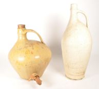 FRANCIS GLANVILE COOPER - TWO EARLY 20TH CENTURY STONEWARE FLAGONS / JUGS