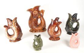 COLLECTION OF SIX 20TH CENTURY CERAMIC FISH GLUG JUG VASES