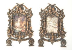 TWO VINTAGE 20TH CENTURY CAST METAL PUTTI FRAMES