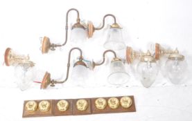 COLLECTION OF SEVEN MID CENTURY BRASS & GLASS WALL SCONCES