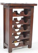 20TH CENTURY INDONESIAN HARDWOOD PEDESTAL WINE BOTTLE RACK STAND