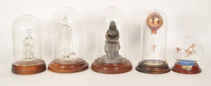 FIVE 20TH CENTURY DOMED GLASS DISPLAY UNITS CONTAINING GLASS FIGURES