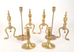 COLLECTION OF 20TH CENTURY BRASS CANDLESTICK HOLDERS AND FIRE DOGS
