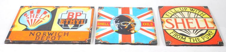 THREE 20TH CENTURY REPRODUCTION ENAMEL STYLE ADVERTISING PAINTINGS